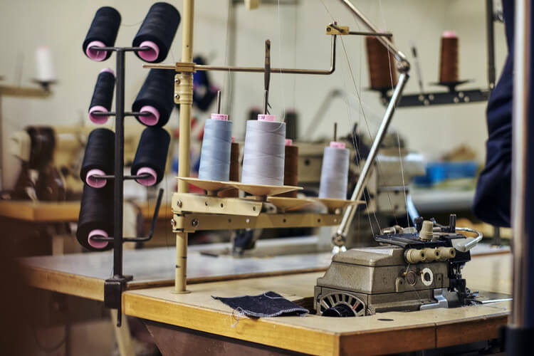 Fabric Sewing machine with threads.