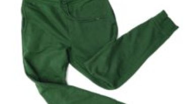 Close-up green sport pants, sweatpants, jogging for men isolated